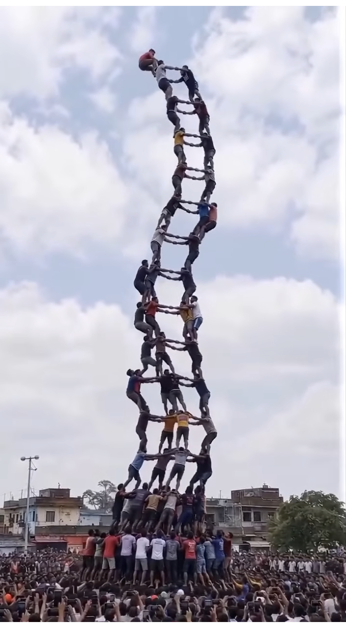 Human Ladder Reaches Dangerous Heights as Climbers Keep Going
